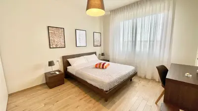 Letto o letti in una camera di Appartamento Leonardo
