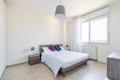 Letto o letti in una camera di Appartamento Leonardo
