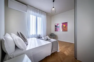 Letto o letti in una camera di YiD Cairoli design apartment