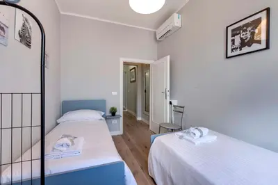 Letto o letti in una camera di Sprone Apartment by Mamo Florence