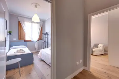 Letto o letti in una camera di Sprone Apartment by Mamo Florence