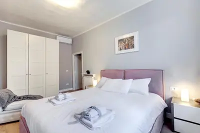 Letto o letti in una camera di Sprone Apartment by Mamo Florence