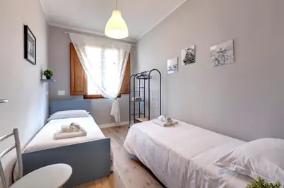 Letto o letti in una camera di Sprone Apartment by Mamo Florence