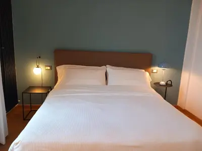 Letto o letti in una camera di Sweetly home in Florence Panoramic Suite con Vista Duomo e appartamento elegante Centro Firenze, Stazione