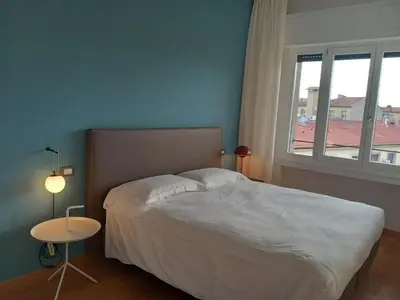 Letto o letti in una camera di Sweetly home in Florence Panoramic Suite con Vista Duomo e appartamento elegante Centro Firenze, Stazione