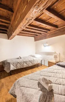 Letto o letti in una camera di appartamento centro Firenze