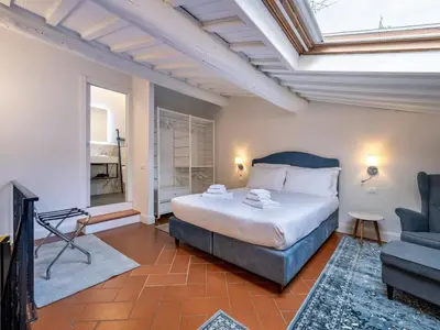 Letto o letti in una camera di Uffizi Suite