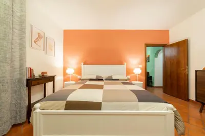 Letto o letti in una camera di Magnoli cozy flat two steps from Ponte Vecchio