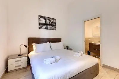 Letto o letti in una camera di Baldovini Apartment by Mamo Florence