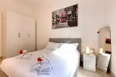 Letto o letti in una camera di Baldovini Apartment by Mamo Florence