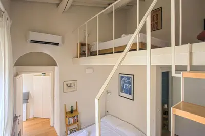 Letto o letti a castello in una camera di Loft Libertà No2