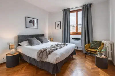 Letto o letti in una camera di Apartments Florence- Accademia Charme