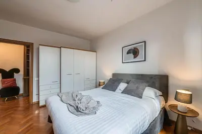 Letto o letti in una camera di Apartments Florence- Accademia Charme