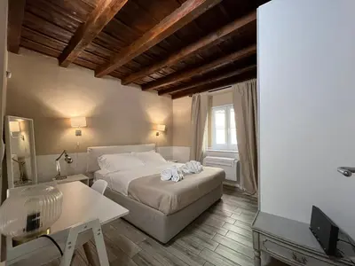 Letto o letti in una camera di Piccolo Rifugio in Santa Croce