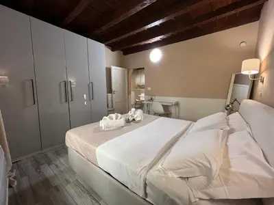 Letto o letti in una camera di Piccolo Rifugio in Santa Croce