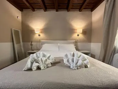 Letto o letti in una camera di Piccolo Rifugio in Santa Croce