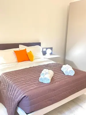 Letto o letti in una camera di Casa Cavour Brown