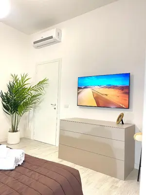 Letto o letti in una camera di Casa Cavour Brown