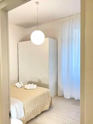 Letto o letti in una camera di Casa Cavour White