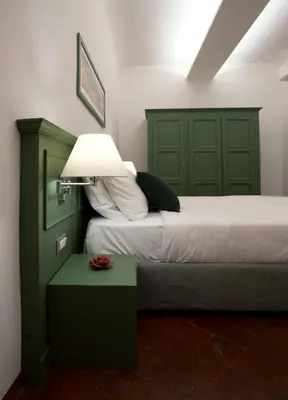 Letto o letti in una camera di Wine Apartments Florence Bolgheri