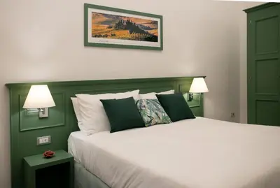 Letto o letti in una camera di Wine Apartments Florence Bolgheri