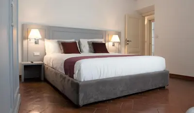 Letto o letti in una camera di Wine Apartments Florence Bolgheri